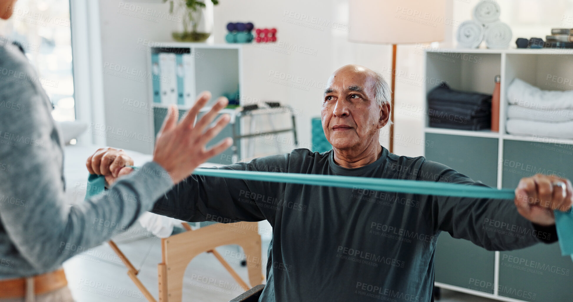 Buy stock photo Man, physiotherapist and stretching with discussion for progress, medical service and recovery. People, mature patient and woman with exercise for injury, rehabilitation and resistance band at clinic