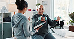 Man, physiotherapist and dumbbell with tablet for progress, medical report for recovery. People, mature patient with a disability and weight exercise for injury, rehabilitation and tech at clinic
