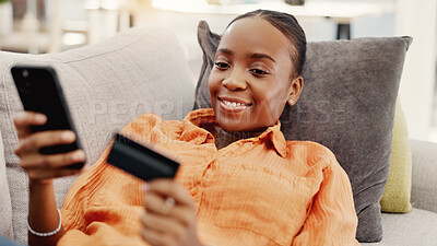 Buy stock photo Black woman, relax and phone with credit card in home for ecommerce, fintech and transaction. Happy, person and mobile for online shopping, easy payment and bank information of purchase subscription