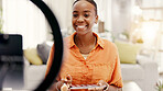 Happy woman, influencer and makeup tutorial on phone, ring light or talking with audience on website. Content creation, mobile and black person with eyeshadow palette, social media and video in home