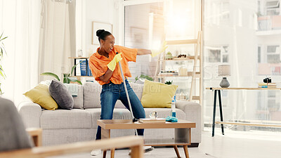 Buy stock photo Cleaning, dancing and black woman with broom, home and energy for hygiene, fun or smile. Maintenance, African person and playful for housework in living room, karaoke and routine for dust and sing