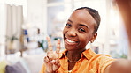 Happy woman, portrait and peace sign for selfie in lounge, vlog and profile picture for social media. Influencer, photography and black person with smile for image, online and memory on web in home