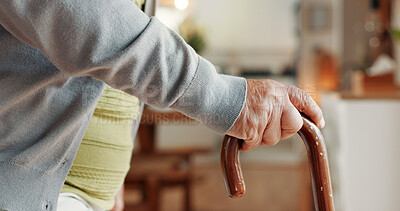 Buy stock photo Senior, hands and walking with cane in home for mobility, old age assistance or recovery aid. Closeup, elderly or person with a disability or wooden stick for stability or support in retirement house