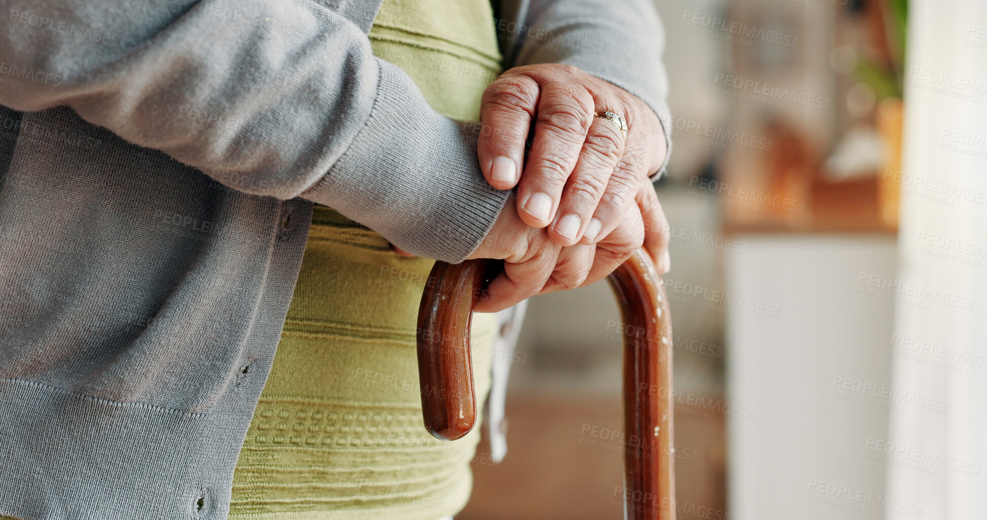 Buy stock photo Elderly, person and hands with cane in home for mobility, old age assistance or walking aid. Closeup, senior or support with wooden stick for stability, safety or help in retirement or nursing house