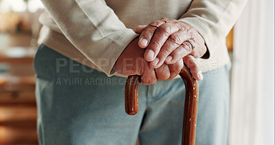 Buy stock photo Elderly, person and hands with walking stick in house for mobility, old age assistance or aid. Closeup, senior or support with wooden cane for stability, safety or help in retirement or nursing home