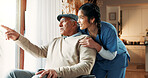 Woman, wheelchair and man pointing by window in nursing home for story, kindness or curious. Elderly patient, wellness and nurse listen to person with a disability for hospice, smile or retirement