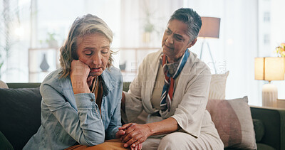 Buy stock photo Upset, woman and holding hands in home with friends, support and compassion for healing from grief. Mature, people and sad person on sofa with trust, understanding or help to process trauma together.