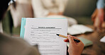 Person, hands or lawyer with document for divorce agreement or legal compliance in home. Attorney, paperwork and application form with negotiation for custody, insurance advice or settlement in house