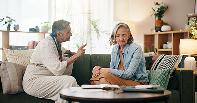 Buy stock photo Argument, mature and lesbian couple in home with relationship issue, conflict and disagreement. House, pointing and women on sofa in discussion, frustrated and fight for lgbtq marriage in living room