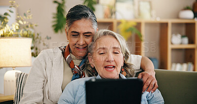 Buy stock photo Tablet, mature and lesbian couple in home with conversation, movie and bonding together on weekend. Happy, lgbt people and relax in living room with tech, relationship and discussion for film choice.