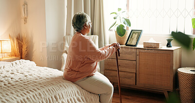 Buy stock photo Thinking, back or old woman in bedroom with walking stick, loss or memory of past mistake. Mental health, reflection and elderly person in home with disability, nostalgia or regret in retirement.