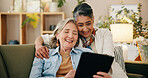 Tablet, mature and lesbian couple in home with laugh, comedy film and bonding together on weekend. Happy, lgbt people and relax in living room with digital tech, relationship or humor for funny movie