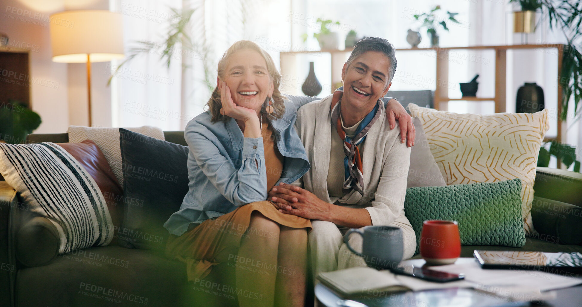 Buy stock photo Lesbian, portrait or couple on couch with hug, commitment or bonding together on weekend break. LGBTQ, flare or mature women with embrace, connection or romantic moment in healthy relationship.