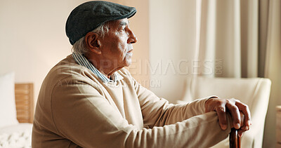 Buy stock photo Thinking, sad or old man in house with walking stick, loss or memory of past mistake in living room. Mental health, reflection and senior person with disability, nostalgia or regret in retirement.