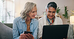 Lesbian couple, senior women and laptop with credit card, retirement or holiday planning in home. LGBTQ people, relationship and budget review with website, payment and savings for online banking
