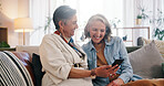 Friends, cellphone and senior women in home, smile and digital app for social media. Happy, apartment and elderly people on sofa, relax or smartphone for website info, connection or online joke