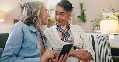 Buy stock photo Friends, smartphone and old women in home, talking and digital app for social media. Pensioner, communication or elderly people on sofa, relax or cellphone for website info, connection or online joke