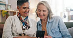 Friends, cellphone and old women in home, funny meme and digital app for communication. Pensioner, smile and senior people on sofa, relax or smartphone for website info, connection or online joke