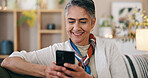 Phone, happy and senior woman on sofa in home with texting, communication or networking online. Relax, smile and elderly female person in retirement with cellphone for contact on mobile app in house.
