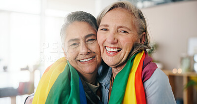 Buy stock photo Lesbian, portrait or couple in house with flag, commitment or bonding together on weekend break. LGBTQ, flare or mature women in home with pride, connection or romantic moment in healthy relationship