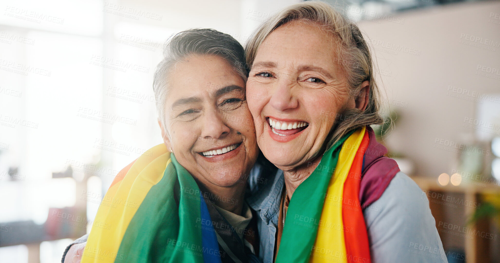 Buy stock photo Lesbian, portrait or couple in house with flag, commitment or bonding together on weekend break. LGBTQ, flare or mature women in home with pride, connection or romantic moment in healthy relationship