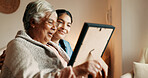 Caregiver, talk and old woman in nursing home with picture frame, bonding and explain good memories. Happy, senior person and nurse in retirement center with photo, discussion and nostalgia for past.