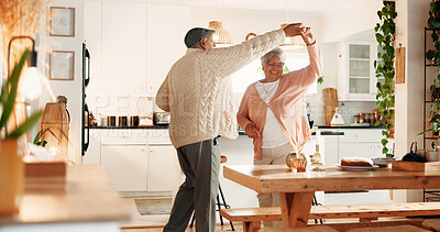 Buy stock photo Dancing, smile and senior couple in kitchen, romance and retirement fun for anniversary celebration. Home, bonding and elderly people with support for healthy relationship, marriage or music for spin