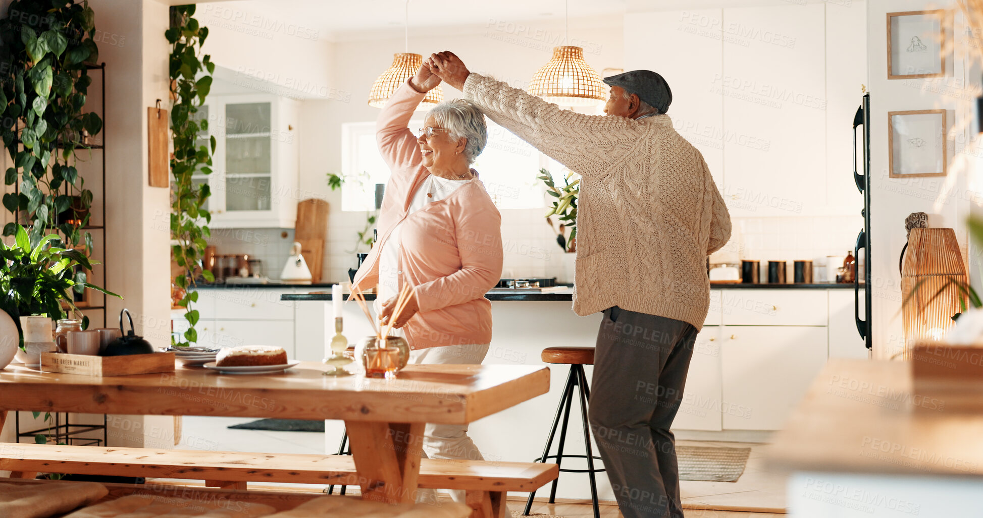 Buy stock photo Dancing, happy and senior couple in kitchen, romance and retirement fun for anniversary celebration. Home, bonding and elderly people with support for healthy relationship, marriage or music for spin