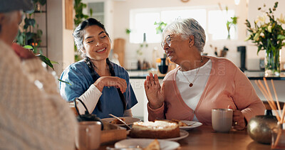 Buy stock photo Caregiver, talk and old couple with cake at house for good news, celebration and treatment success. Smile, nurse and senior people with dessert for tea time, assisted living and healthcare milestone
