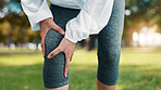 Hands, knee pain and hurt at park, fitness and athlete with sprain after exercise or muscle tension. Outdoor, training accident and person with workout injury in nature, inflammation and leg fracture