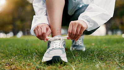 Buy stock photo Person, hands and tying with shoes on grass field for fitness, workout preparation or run in nature. Active, runner or getting ready with sneakers or laces for outdoor exercise or training in park