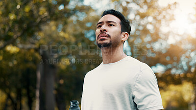 Buy stock photo Man, fitness and thinking with water at park, serious and tired after workout or training in morning. Outdoor, athlete and person with drink in nature, reflection and cool down on break and low angle
