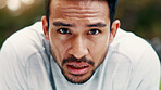 Man, sweat and portrait for fitness at park, serious and exhausted with fatigue on break. Person, runner and outdoor with nature for exercise, cardio challenge and burnout for wellness in Cambodia
