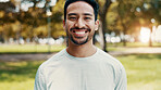 Man, smile and portrait at park for fitness with confidence, pride and outdoor in urban town. Asian person, happy and runner with break in nature, sunshine or ready with wellness in Indonesia
