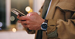 Phone, hands and businessman in office at night with texting, communication or networking. Technology, contact and male person with typing email on mobile app for project deadline in workplace.