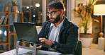Night, glasses or journalist in office with laptop, draft edit or fact checking in article review. Bokeh, specs or male person in agency with tech, proofreading or industry research in overtime.