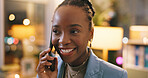 Black woman, phone call and happy at night in office with contact, listen and communication at startup. African person, smartphone and smile for overtime, good news or feedback at creative agency