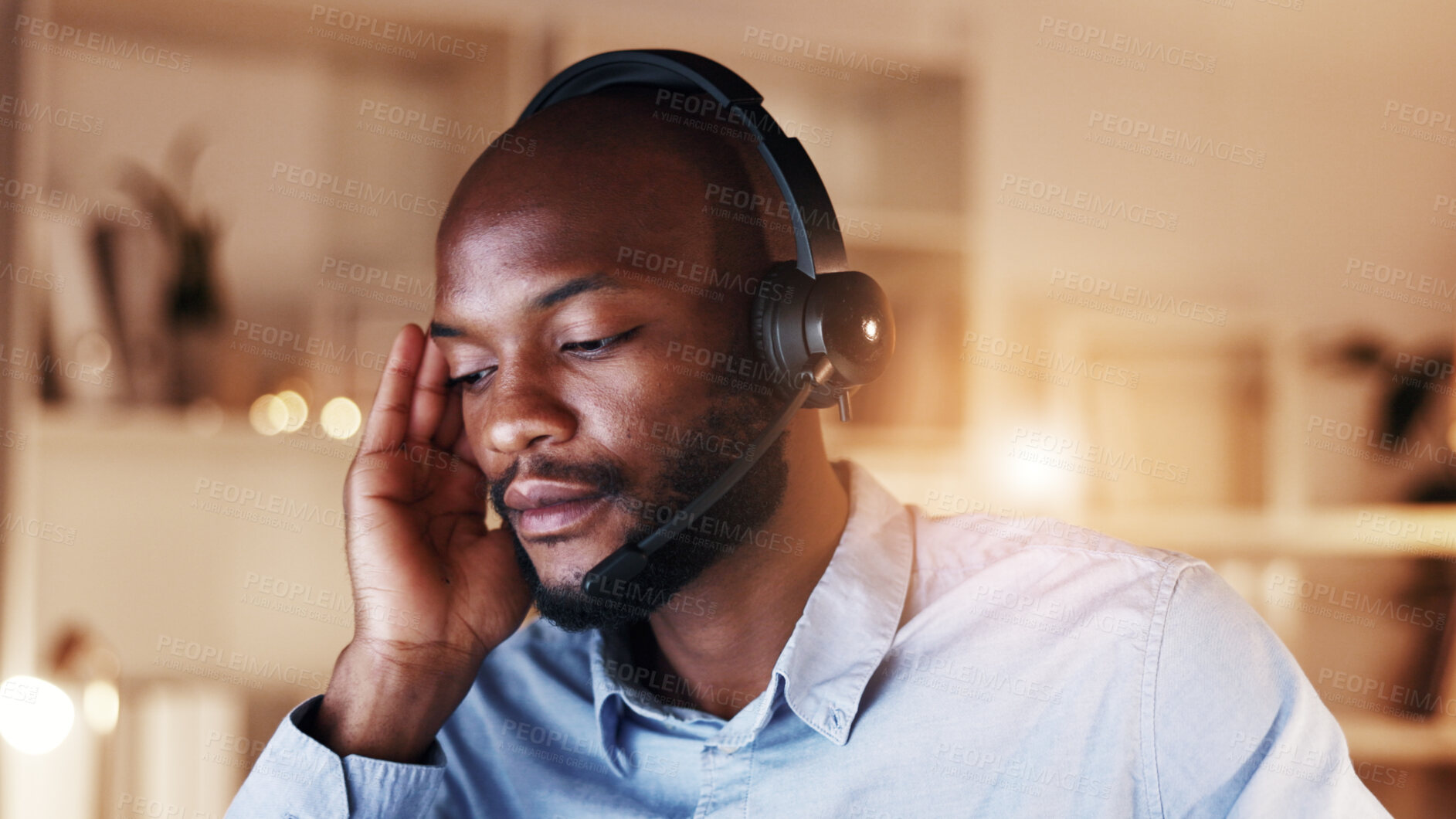 Buy stock photo Tired, black man and consultant with headset in home for fatigue, overtime or late evening. Male person, freelance agent or employee working at night with stress for burnout or pressure in house