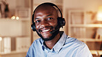 Call center, happy man and portrait in office at night for help desk, communication and advice. African agent, client assistance or customer support with telecom, headset and smile at workplace