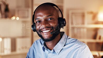 Buy stock photo Call center, happy man and portrait in office at night for help desk, communication and advice. African agent, client assistance or customer support with telecom, headset and smile at workplace