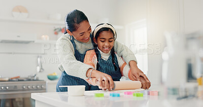 Buy stock photo Smile, mother and child baking with dough for learning, culinary skills and bonding together. Woman, kid and helping with rolling pin, preparing pastry and teaching recipe for handmade snack at house