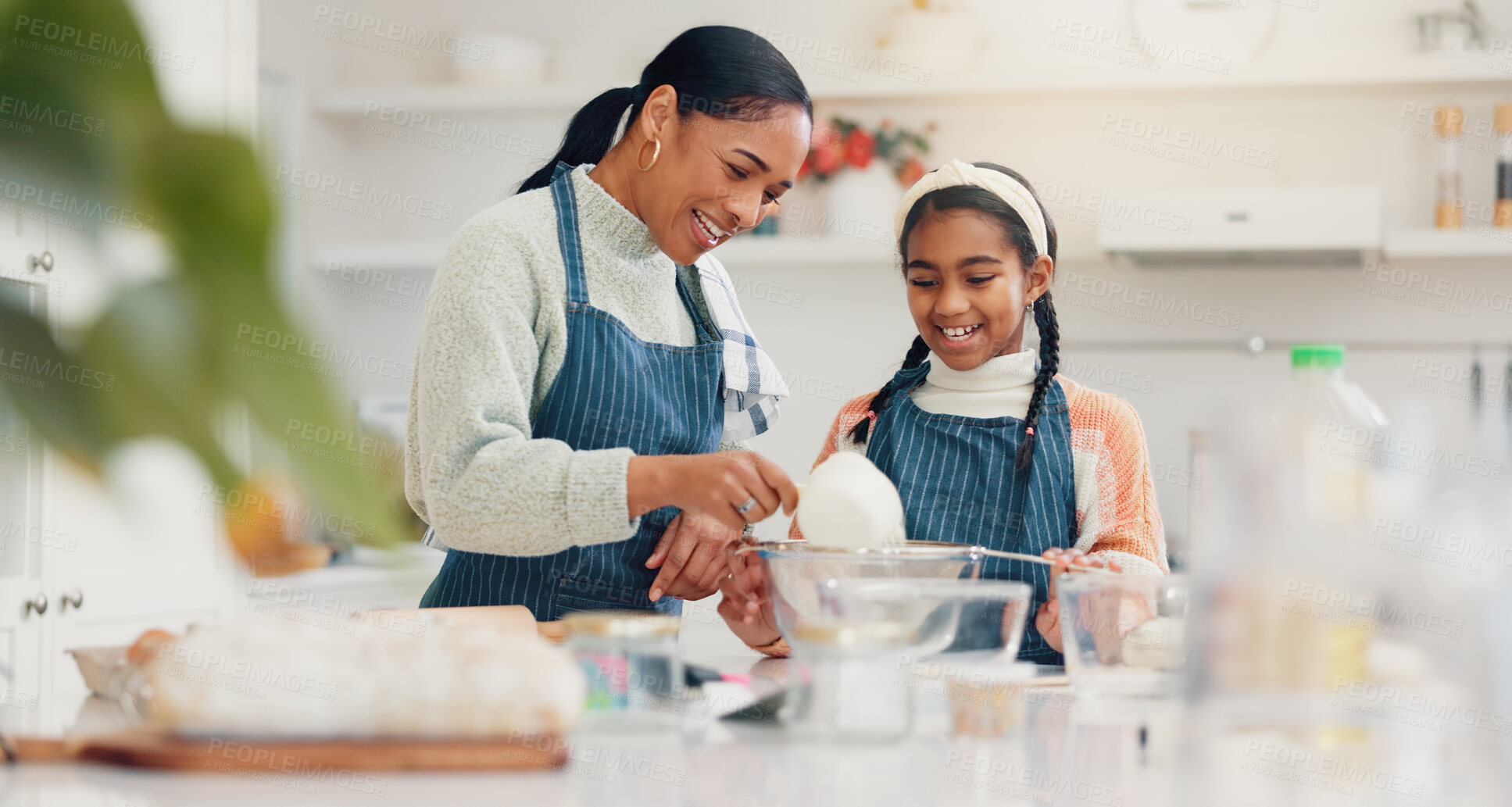 Buy stock photo Baking, flour and mother teaching daughter in kitchen of home for child development or growth. Cooking, ingredients and recipe with girl learning how to bake in apartment for bonding or family time