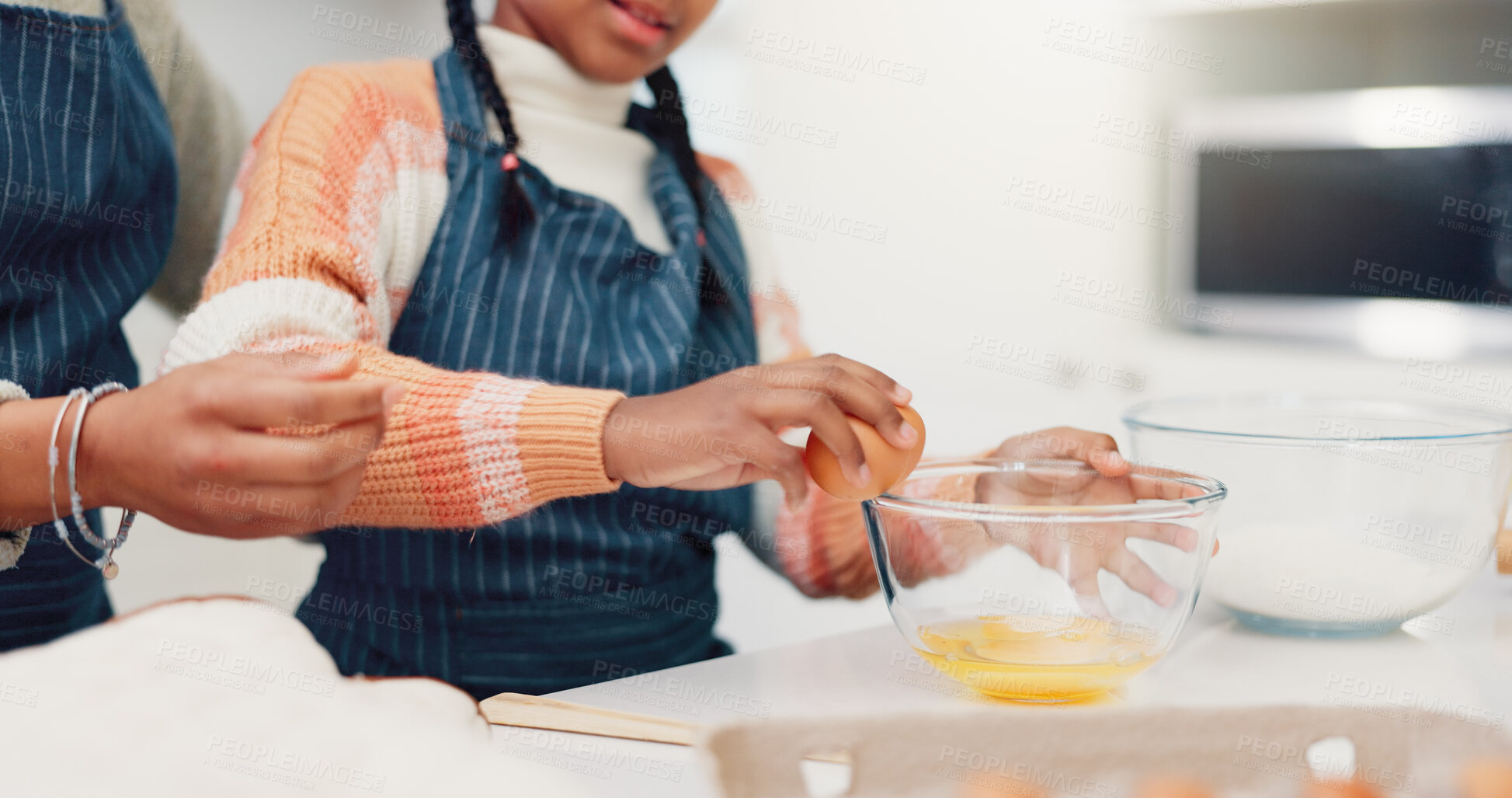 Buy stock photo Hands, mother and child baking with eggs for learning, culinary skills and bonding together. Person, kid and helping with ingredients, preparing dough and teaching recipe for handmade snack at house