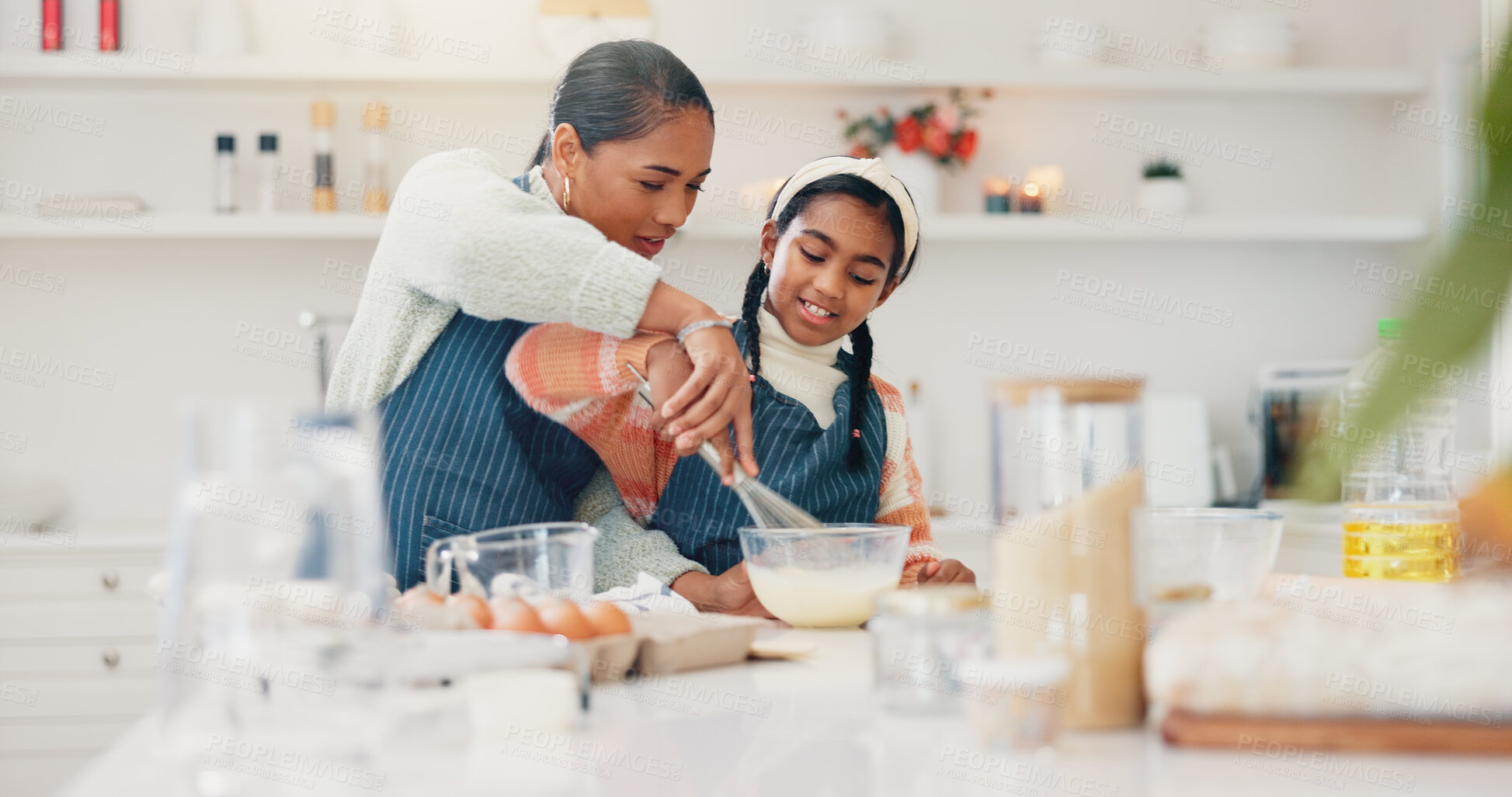 Buy stock photo Baking, mixing and mother teaching daughter in kitchen of home for child development or growth. Bowl, ingredients and recipe with girl learning how to bake in apartment for cooking or family time
