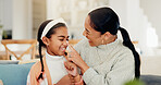 Happy, love and mother with child on sofa for bonding, care and connection together in living room. Smile, relax and mom with girl kid for fun, laughing and family time on weekend in apartment.