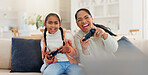 Video game, mother and girl in home, smile and excited for victory, fun and relax in living room. Esports, family and mama in lounge, funny and laughing for humor, online playing and entertainment