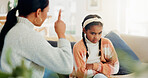 Mother, scold and child with warning at house for discipline, disobedience and bad behavior. Woman, reprimand and lecture kid on attitude, teaching consequences and responsibility with strict parent