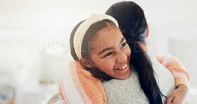 Buy stock photo Mother, daughter and hug in home with smile, connection and love for bonding together on weekend break. Space, happy child and woman in living room with embrace, wellness and support for development.