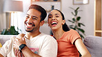 Relax, couple and watching tv with laugh on sofa for comedy movie, weekend entertainment or bonding. Hug, happy people and streaming subscription in home for funny series, comic film and relationship