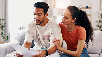 Buy stock photo Couple, documents and planning with finance on sofa for mortgage expenses, bills or budget in home. Man, woman or paperwork with invoices for financial assessment, tax or rent together in house